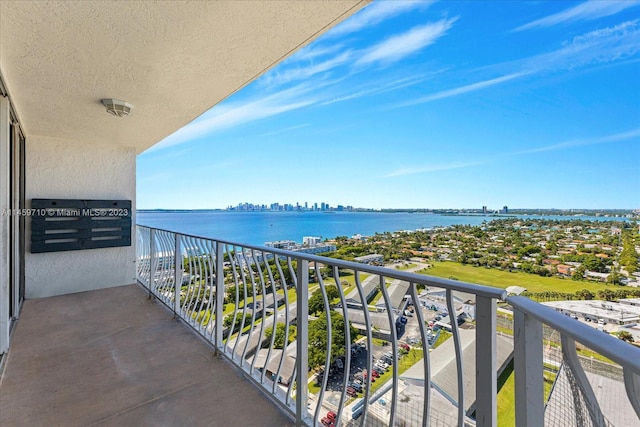 balcony featuring a water view