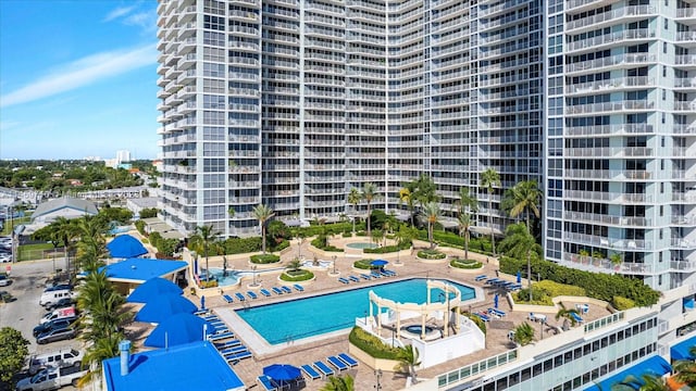 view of building exterior with a community pool