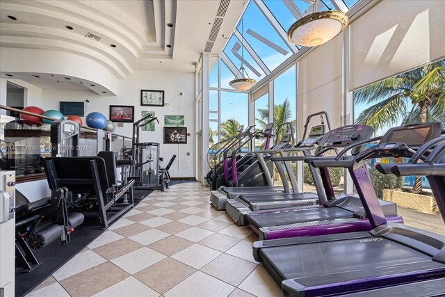 workout area featuring light tile flooring