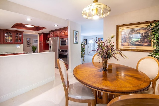 19720 SW 242nd Ter, Homestead, FL 33031 - tiled dining room with a chandelier and a raised ceiling