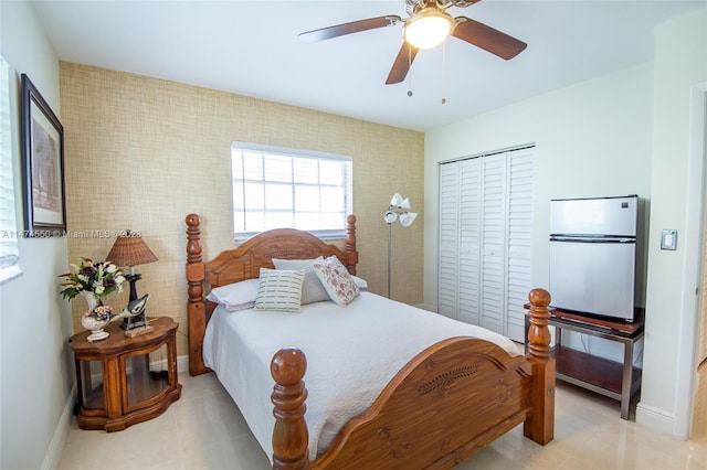 19720 SW 242nd Ter, Homestead, FL 33031 - bedroom with a closet, ceiling fan, light tile flooring, and stainless steel refrigerator