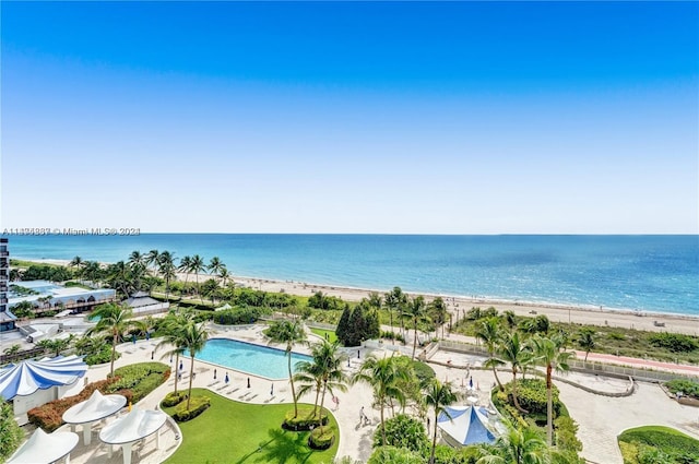 bird's eye view featuring a water view and a view of the beach