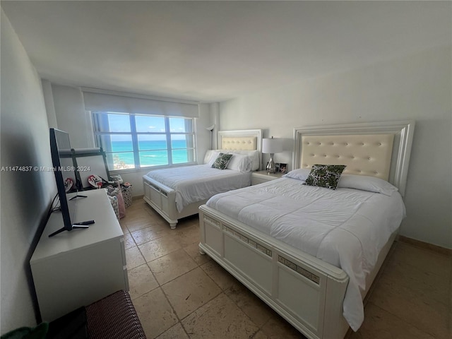 bedroom featuring light tile floors