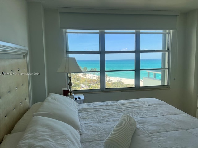 bedroom featuring a water view