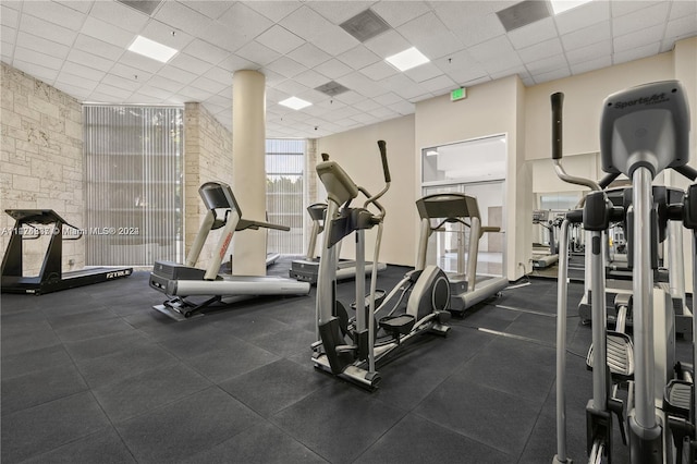 gym featuring a drop ceiling