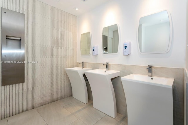 bathroom with tile floors and double sink