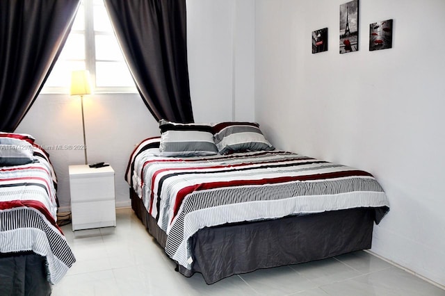 bedroom featuring light tile flooring