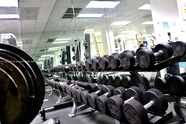 workout area with a paneled ceiling