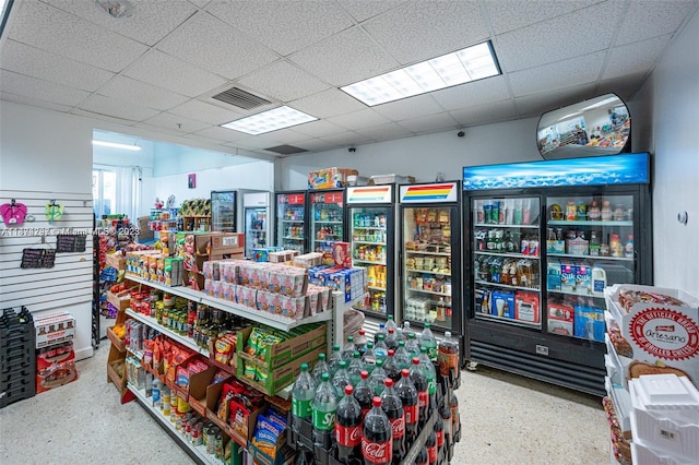 interior space with a paneled ceiling