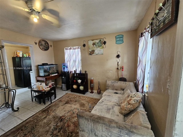 tiled living room with ceiling fan