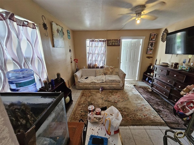 living room with light tile patterned floors and ceiling fan