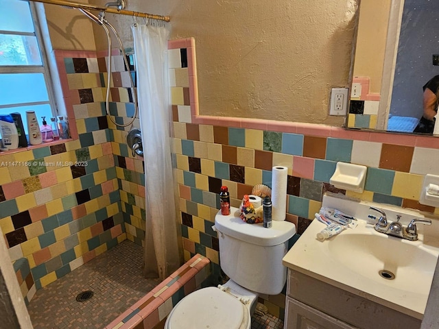 bathroom featuring a shower with curtain, vanity, tile walls, and toilet