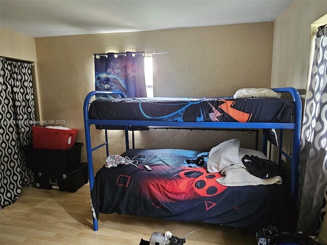 bedroom featuring hardwood / wood-style flooring