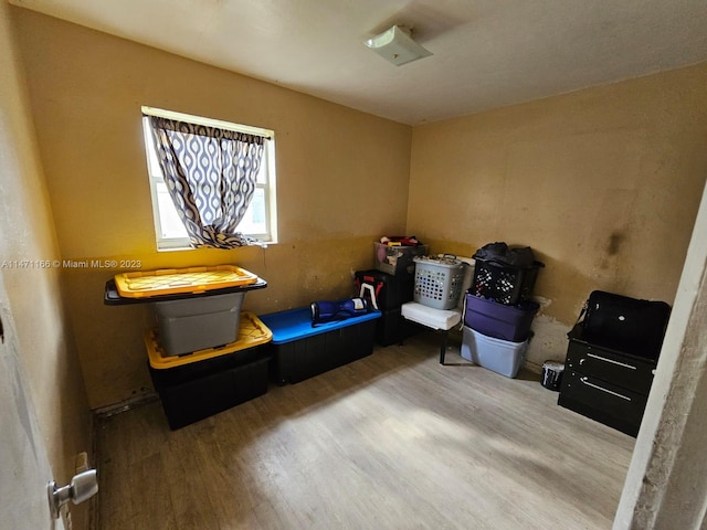 miscellaneous room featuring hardwood / wood-style floors