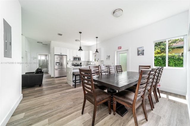 dining room featuring light hardwood / wood-style flooring