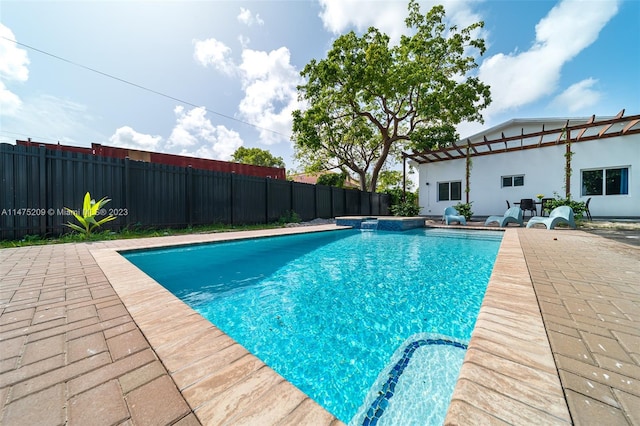 view of swimming pool featuring a patio area