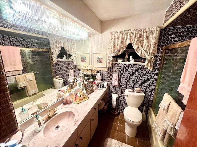 bathroom with tile walls, tile floors, toilet, and oversized vanity