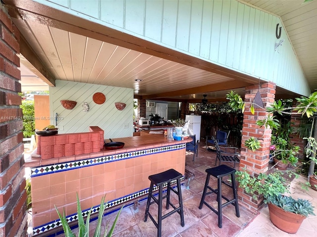 view of terrace featuring ceiling fan