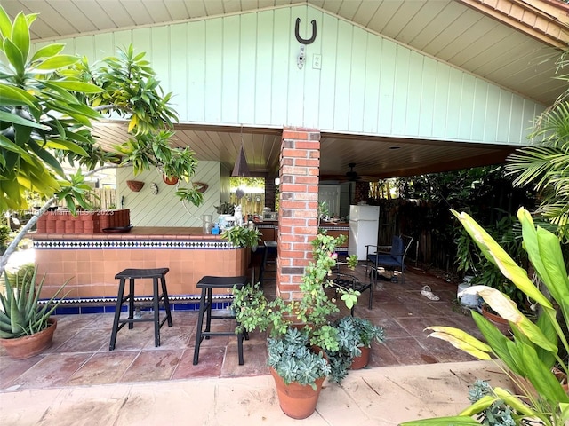 view of patio / terrace featuring an outdoor bar