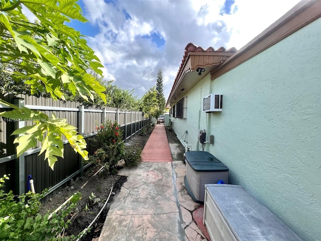 view of terrace with a wall mounted air conditioner