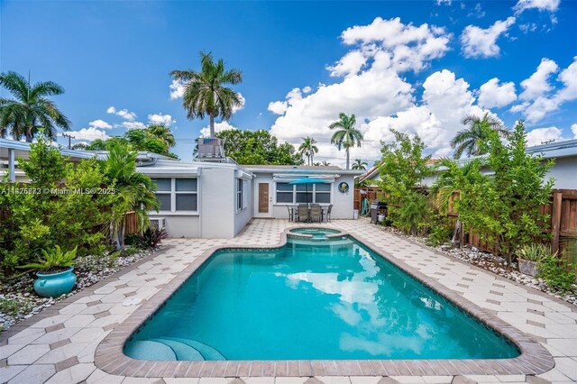 view of swimming pool featuring a patio area