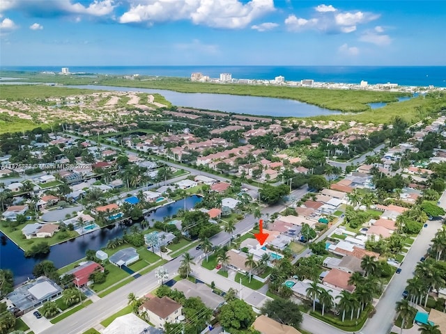 drone / aerial view with a water view