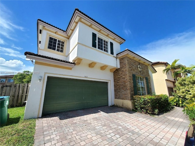 mediterranean / spanish-style house featuring a garage