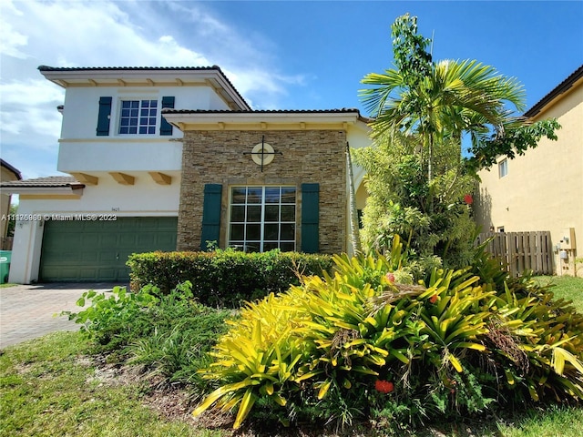 mediterranean / spanish-style home featuring a garage