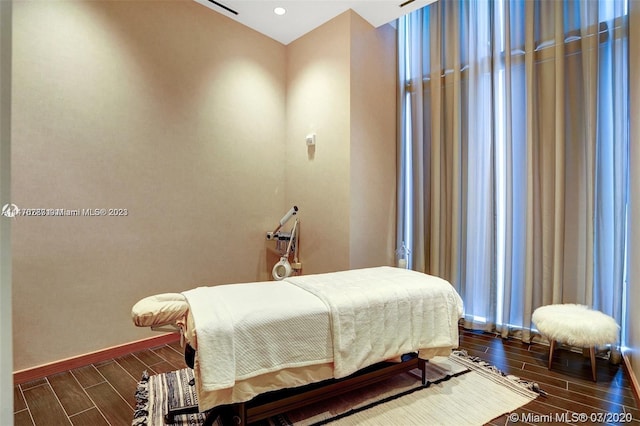 bedroom featuring dark hardwood / wood-style flooring