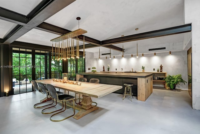 dining area with a notable chandelier, french doors, and beamed ceiling