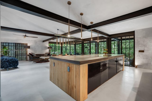 kitchen with a kitchen island, vaulted ceiling with beams, decorative light fixtures, and ceiling fan