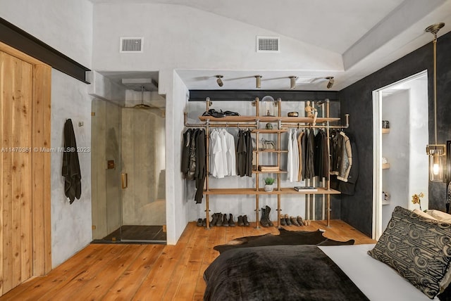 interior space with vaulted ceiling and light wood-type flooring