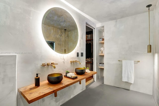 bathroom featuring concrete floors