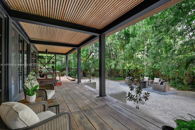 wooden deck with an outdoor hangout area