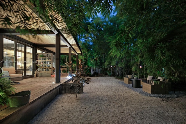 exterior space with a wooden deck and a pergola