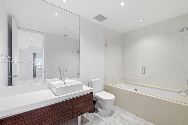 full bathroom featuring enclosed tub / shower combo, toilet, tile flooring, and vanity