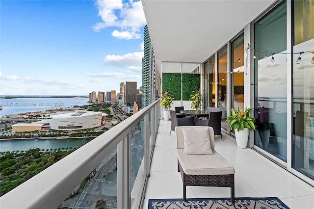 balcony featuring a water view