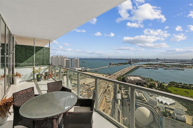 balcony featuring a water view