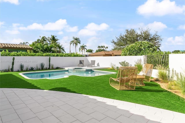 view of pool featuring an in ground hot tub, a patio area, and a lawn