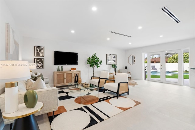 living room with french doors and light tile patterned floors