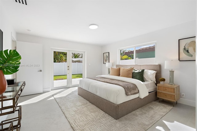 carpeted bedroom featuring access to outside and french doors