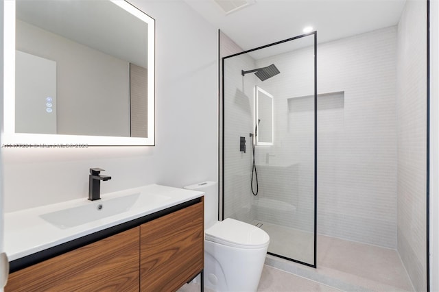 bathroom featuring vanity, toilet, and walk in shower