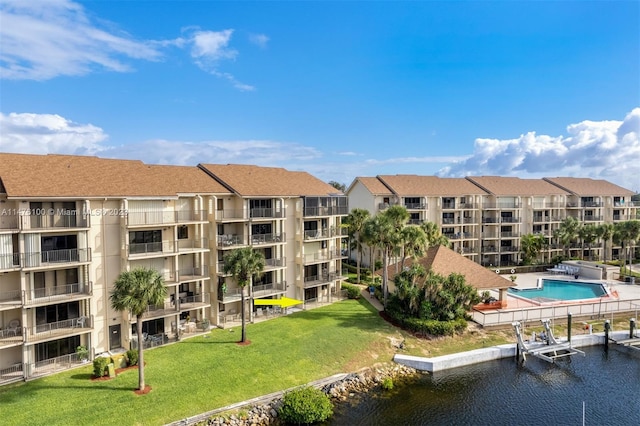 view of property featuring a community pool