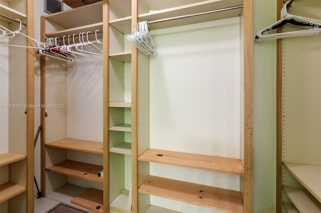 spacious closet with light tile flooring