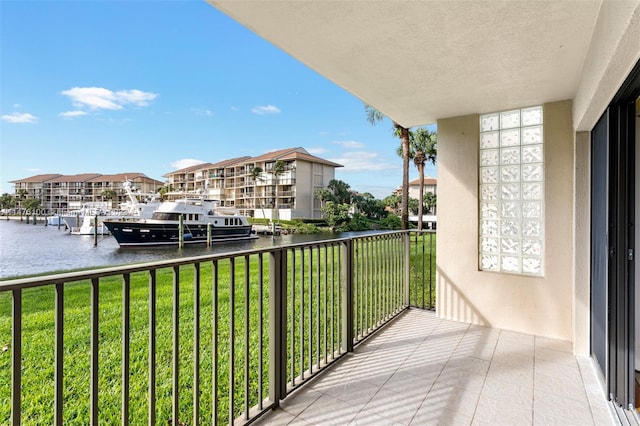 balcony featuring a water view