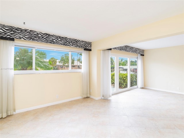 view of tiled spare room