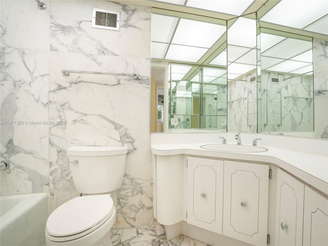 full bathroom with toilet, tiled shower / bath combo, vanity, tile walls, and tile floors