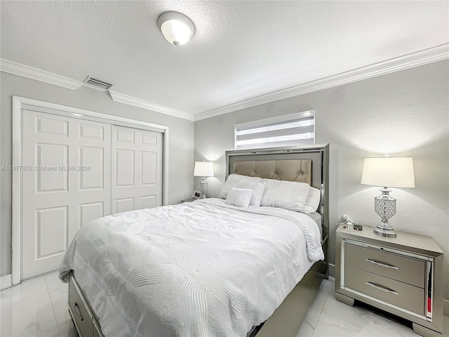 tiled bedroom with crown molding and a closet