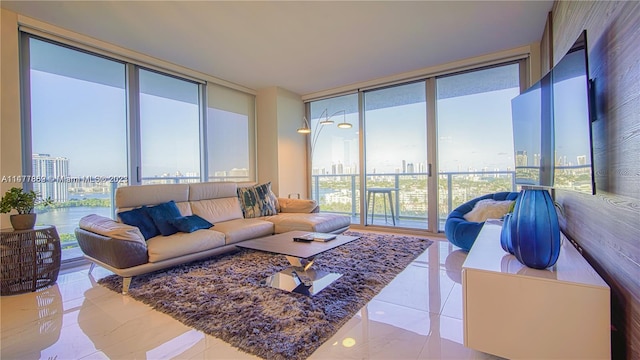 living room featuring expansive windows, light tile floors, and a wealth of natural light