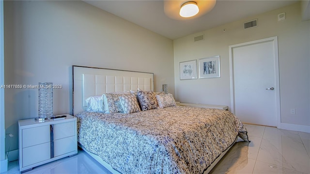 bedroom featuring light tile floors